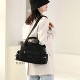 Sac à bandoulière étanche avec plusieurs poches pour femme