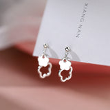 Boucles D'oreilles Fleurs Délicates Et Élégantes