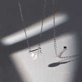 Collier avec pendentif en perle