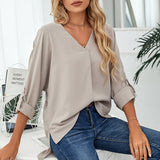 Chemise élégante ample à col en V