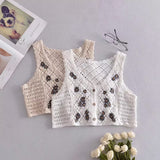 Gilet en tricot à marguerites