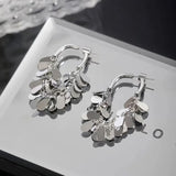 Boucles d'oreilles pompons à sequins