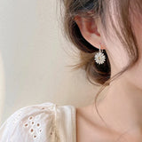 Boucles d'oreilles marguerites élégantes