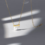 Collier avec pendentif en perle