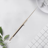 Cure-dents rétractables en titane