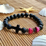 Bracelet de perles d'ambre à croix intérieure