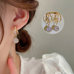 Boucles d'oreilles à la mode avec couronne de diamants
