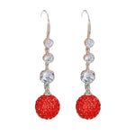 Boucles d'oreilles élégantes longues boules rouges pleines de diamants