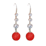 Boucles d'oreilles élégantes longues boules rouges pleines de diamants