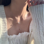 Collier double anneau perle et diamants
