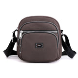 Petit sac à bandoulière carré en nylon de couleur unie