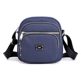 Petit sac à bandoulière carré en nylon de couleur unie