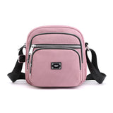 Petit sac à bandoulière carré en nylon de couleur unie