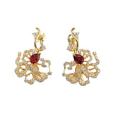 Boucles d'oreilles puces rubis cerclées d'or