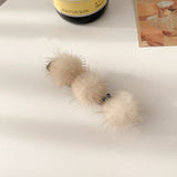 Clip de Bec de Canard en Boule de Poils