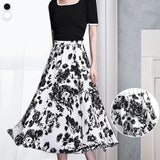 Jupe trapèze mi-longue coupe ajustée élastique simple