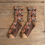 Chaussettes mi-mollet à fleurs en relief
