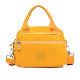 Sac à main fonctionnel à plusieurs compartiments de couleur unie