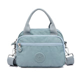 Sac à main fonctionnel à plusieurs compartiments de couleur unie